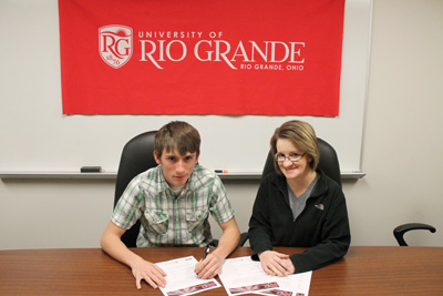 Northmor High's Clint Crose poses with his mother, Aleatha, after signing to run for Rio Grande